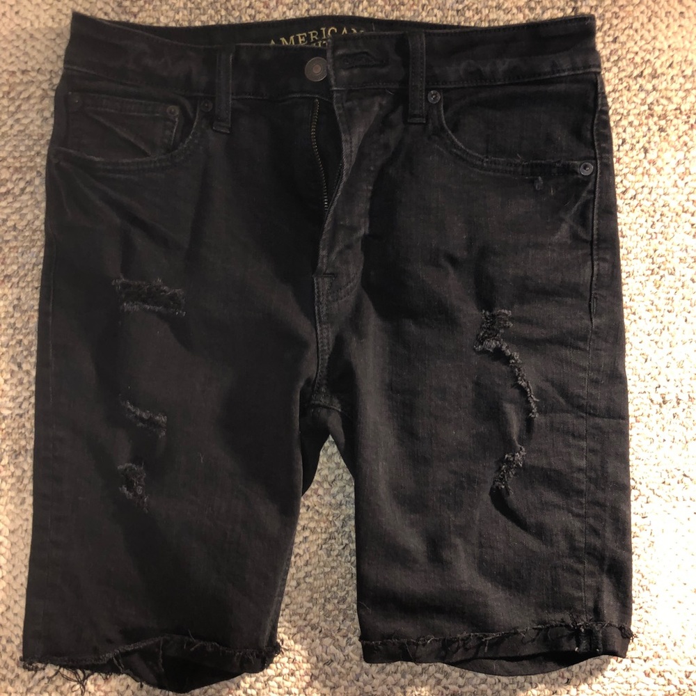 Black jean shorts with rips